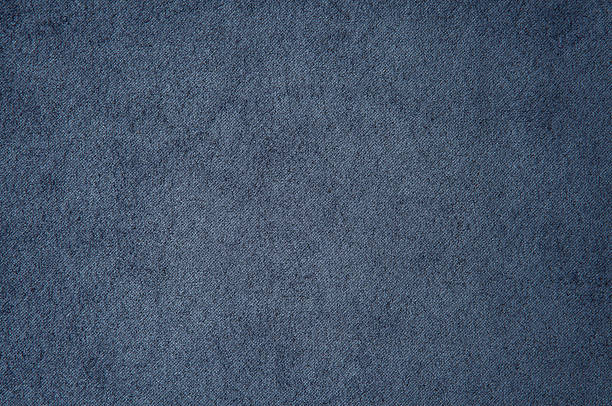 steel blue coloured textured carpet background viewed flat, from above.