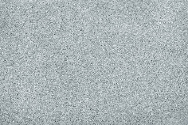 White or light gray felt background. Carpet, table surface or fabric texture design